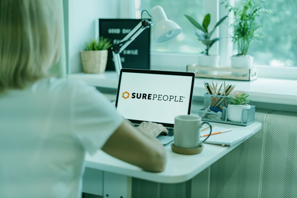 computer screen with Surepeople logo