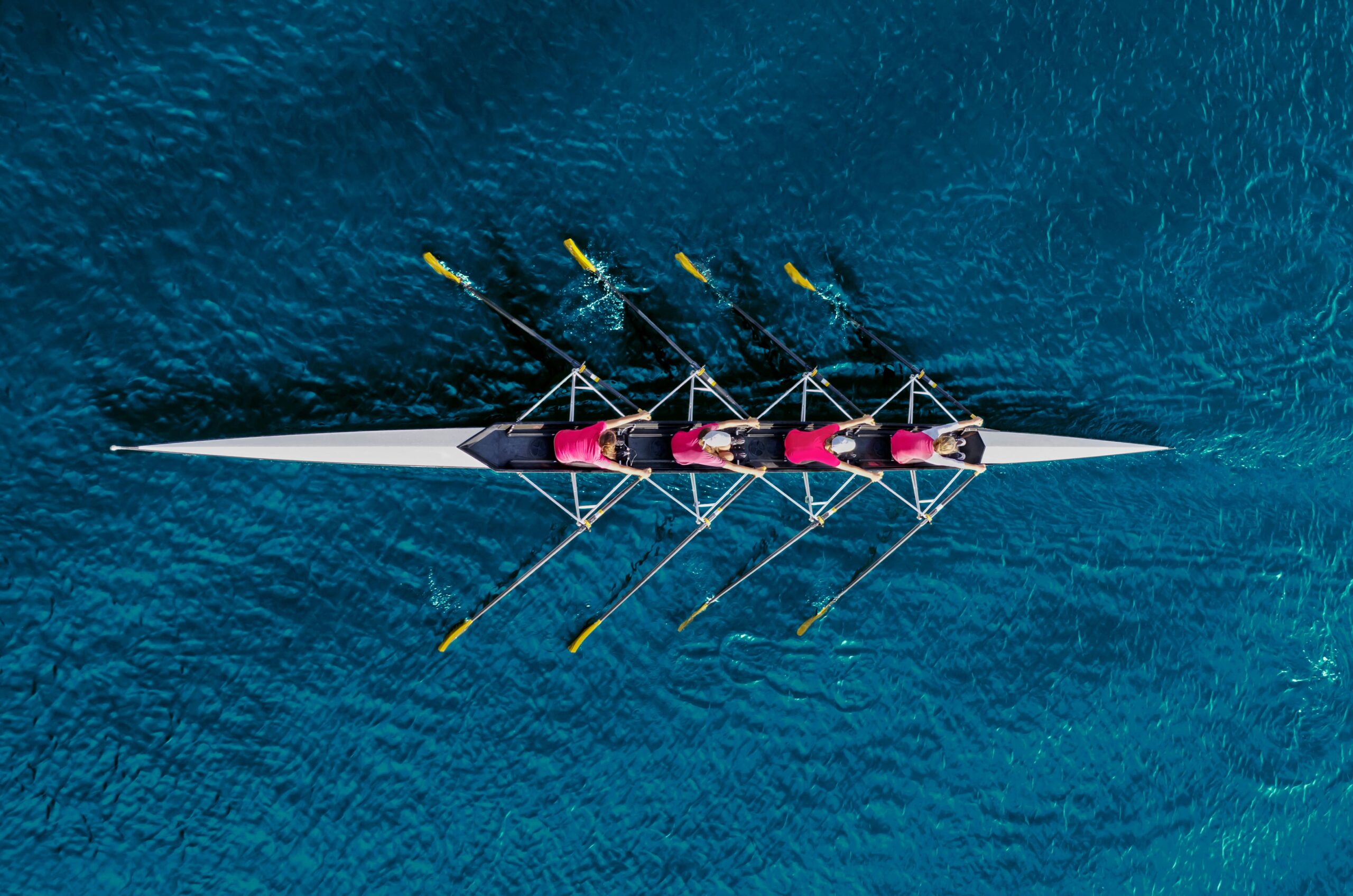 top down view of team rowing a boat