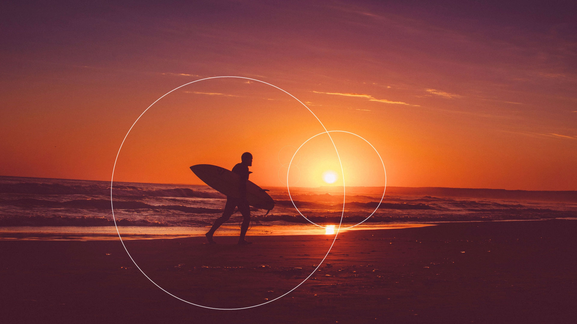 surfer on a beach with sunset in background