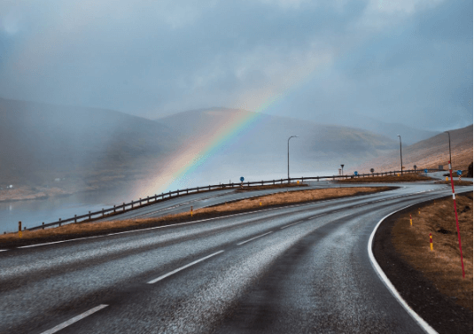 Image of an Rainbow going over a road