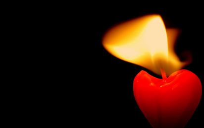 A red burning candle
