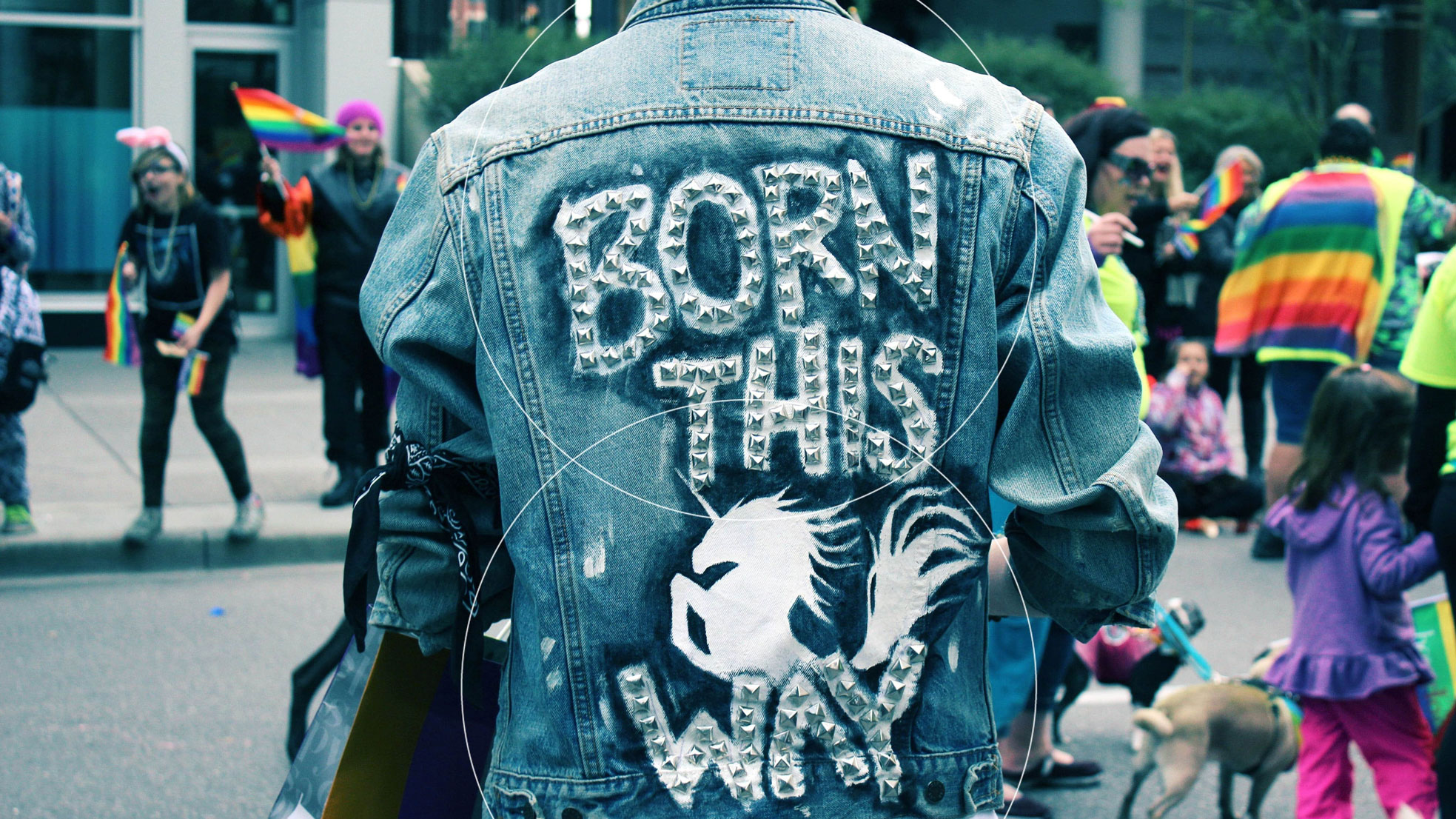 jean jacket at a gay pride event with the words "born this way"